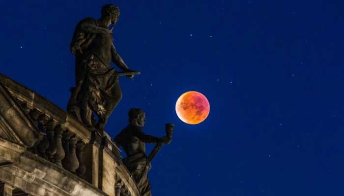 When will the partial lunar eclipse and blood moon be seen this month?