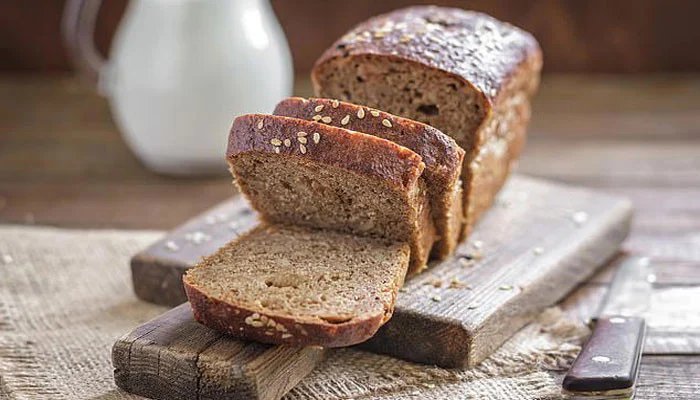 Two slices of whole-grain bread a day may help reduce waist size, research suggests