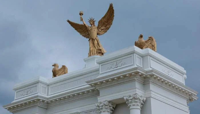 Why was a 250 feet high arch built near the cemetery? Trump said